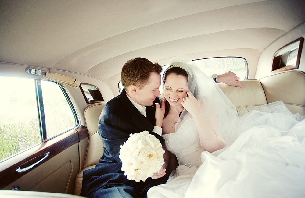 photography of bride and groom in a limo at a British Columbia wedding